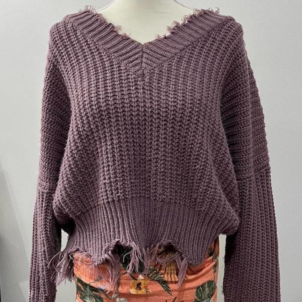 Main strip distressed off the shoulder sweater